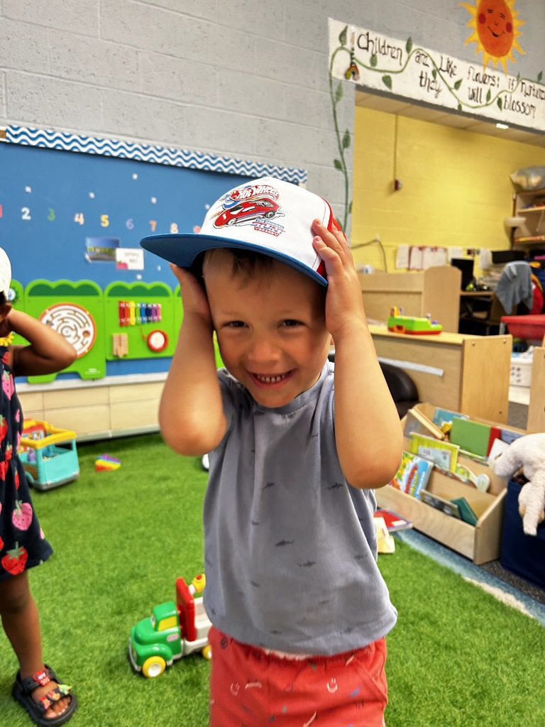 Boy in white hat.