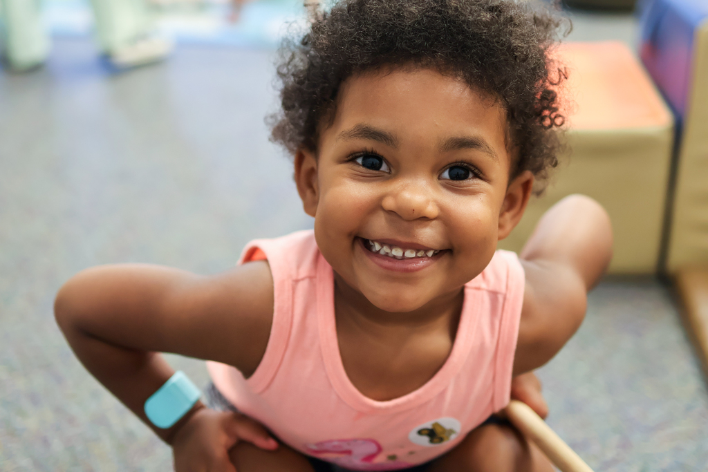a young girl smiles for a photo