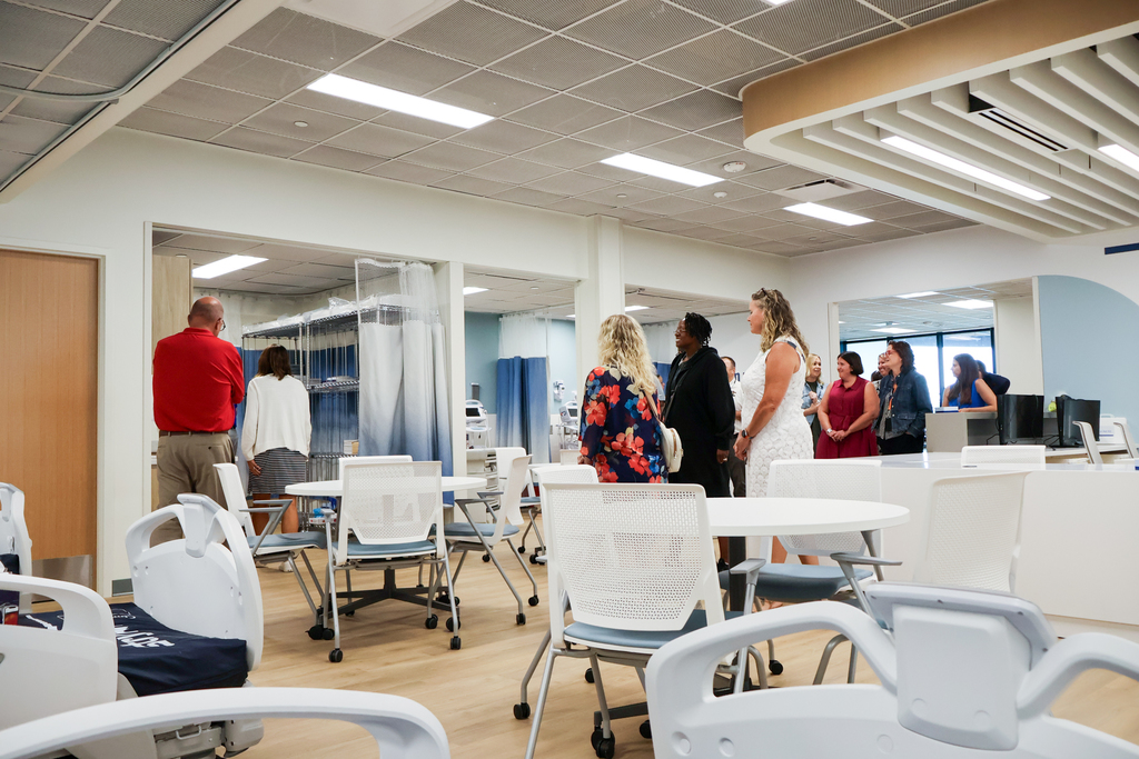 people tour a hospital learning setting