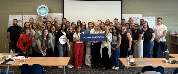 a large group of people pose for a photo