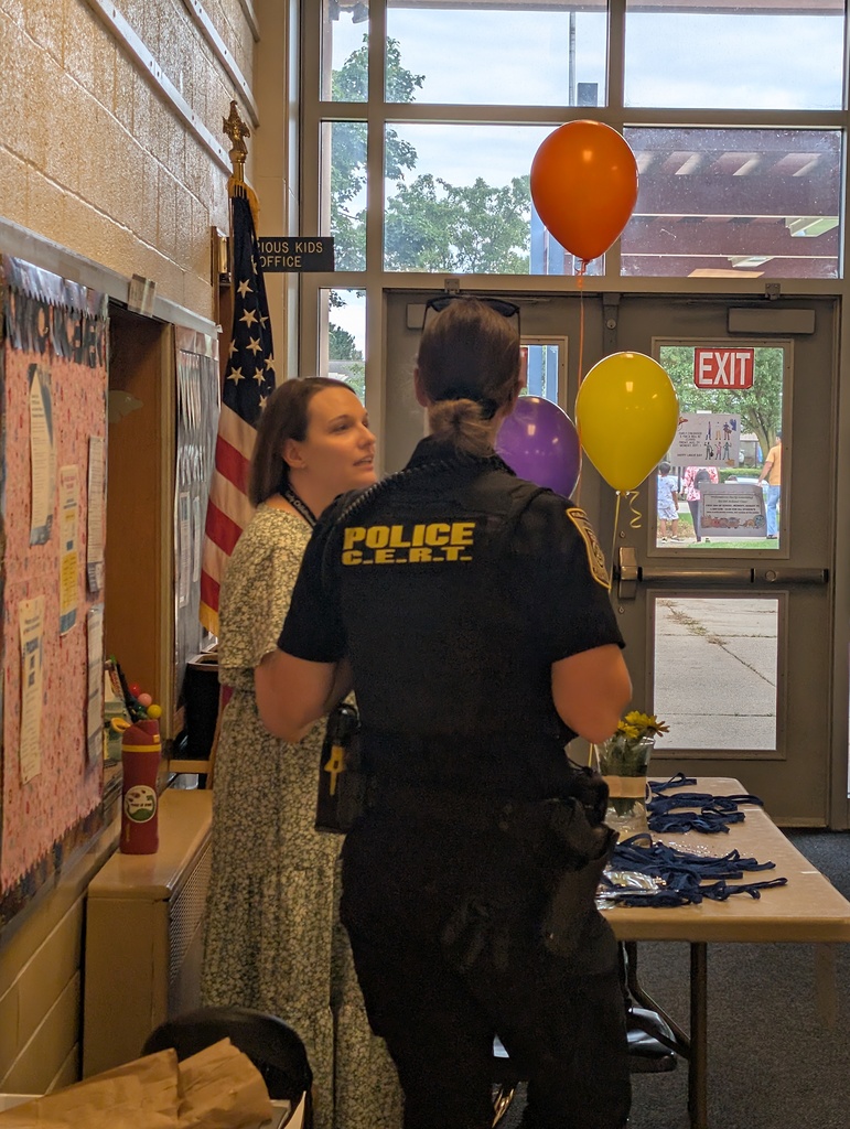 Police Officer talking to the Coordinator.