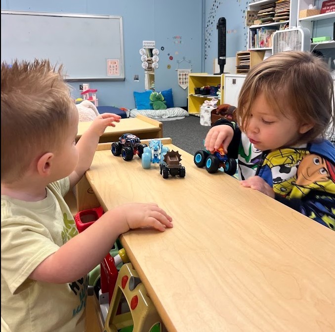 boys playing with cars.