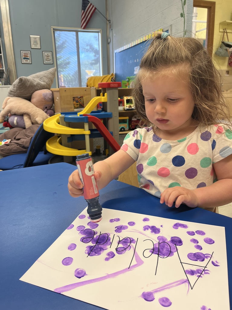 Little girl painting.
