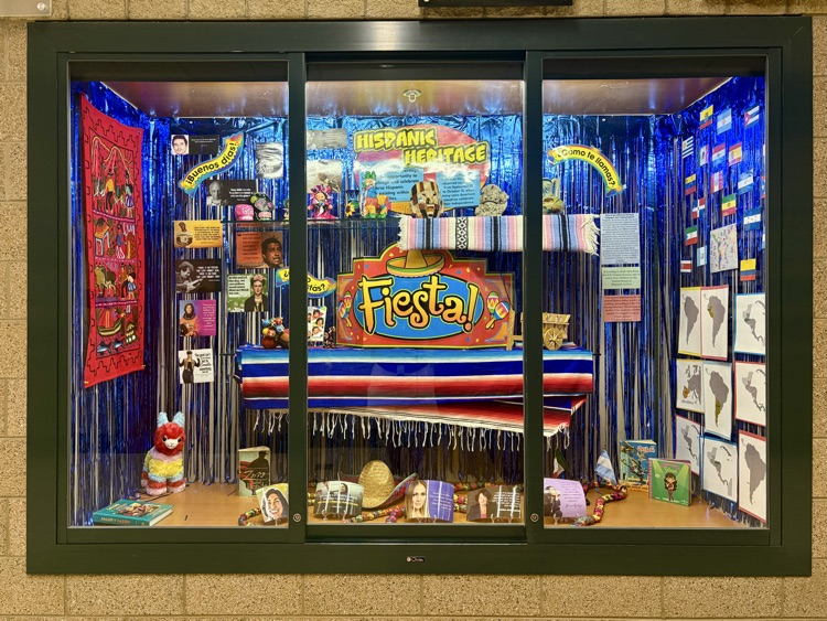a display case full of items celebrating Hispanic heritage month