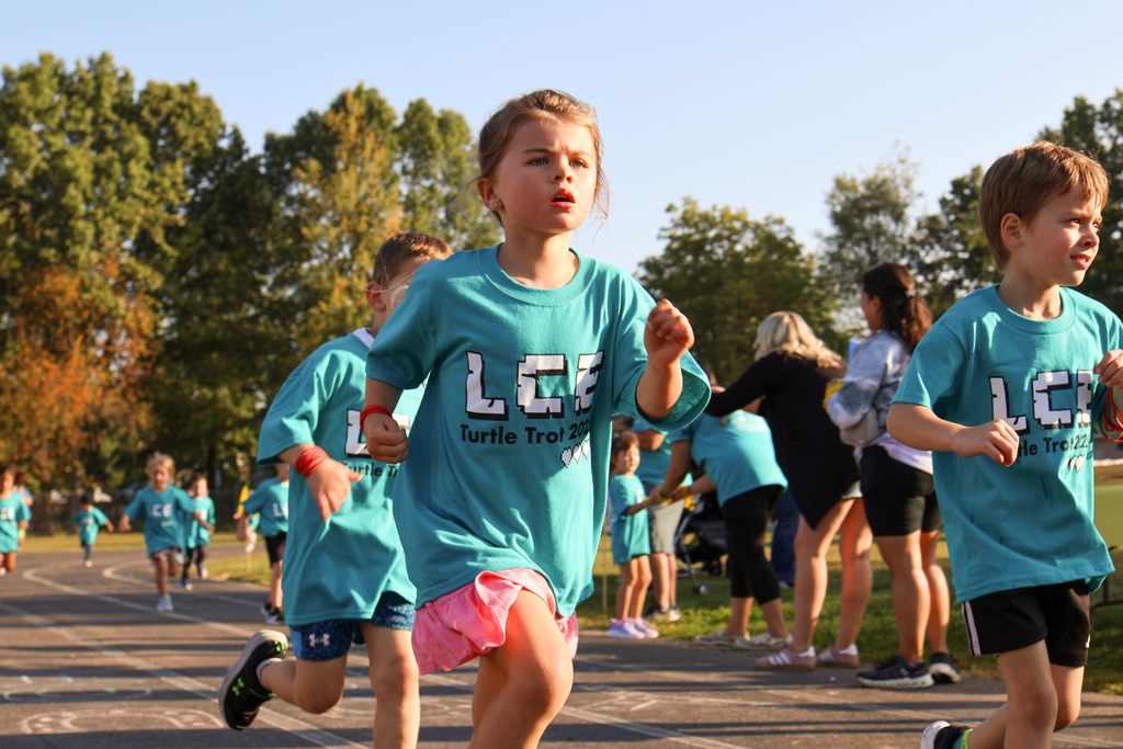 children running on an outdoor track