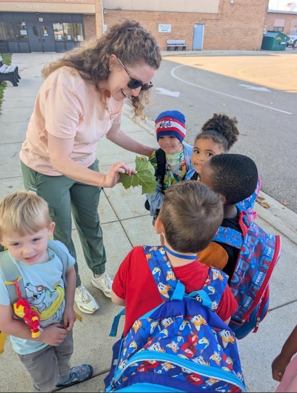 Students showing their teachers what they found.