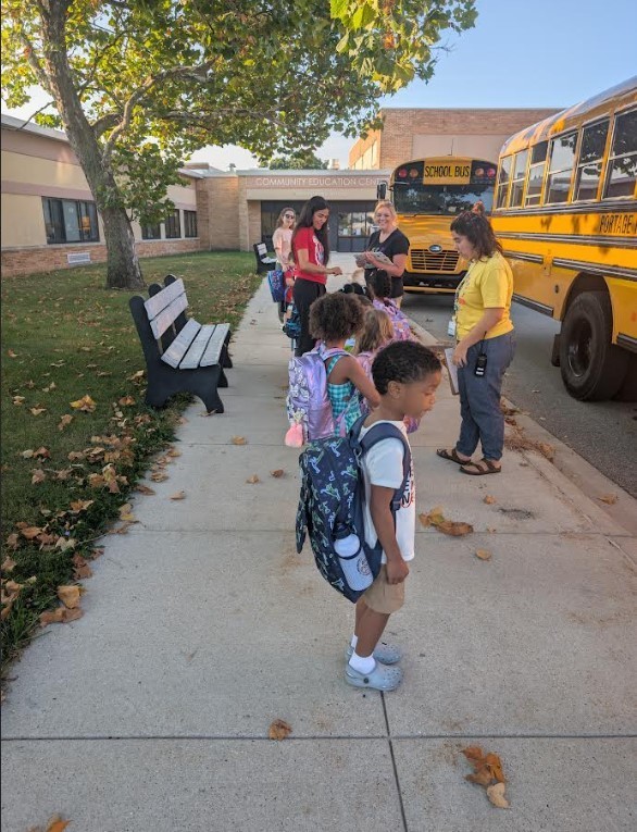 students lining up from their busses.