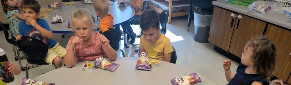 Students eating snack together.