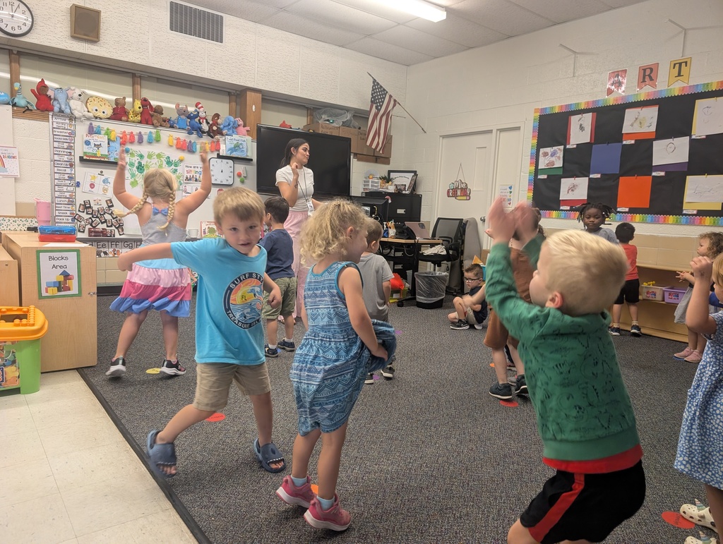 Students dancing at the rug together.