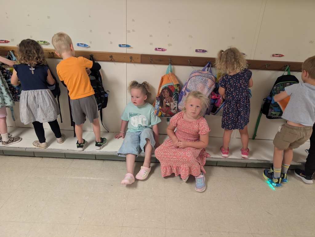 Students practicing to put their items away.