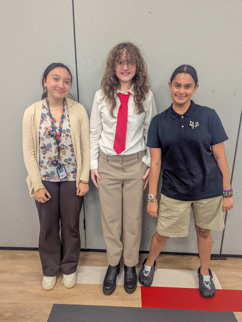 three students pose for a photo