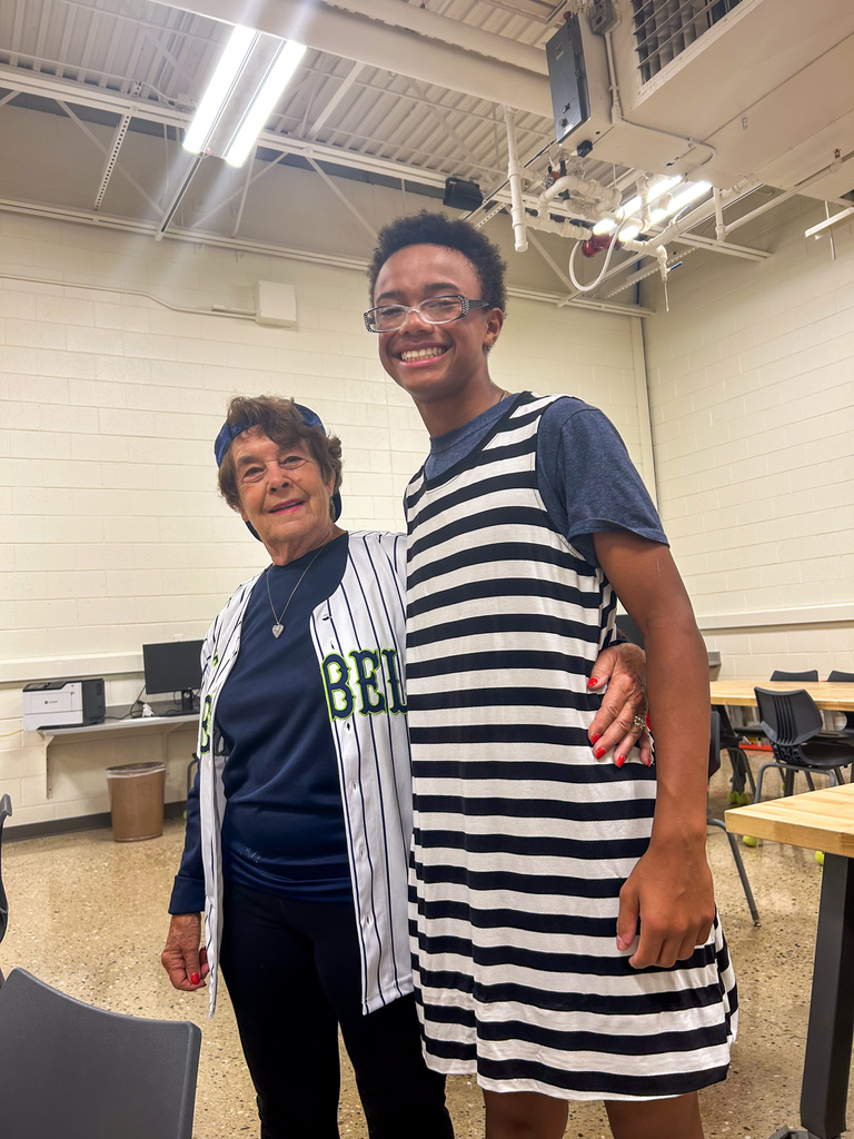 a woman and student pose for a photo