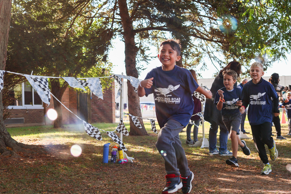 boys running outside through bubbles
