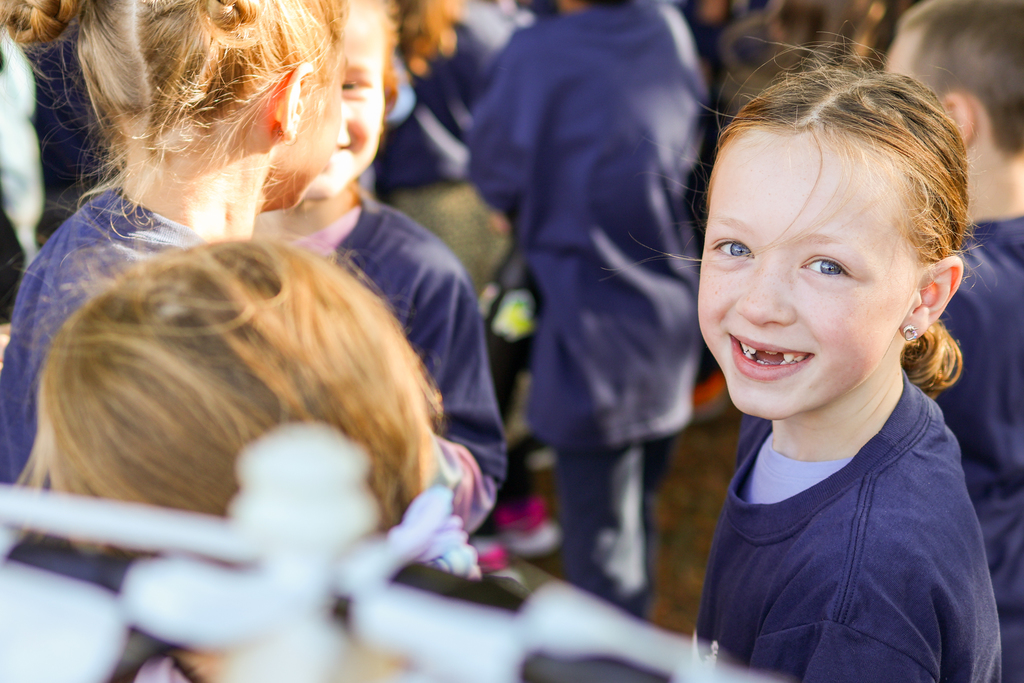 a girl smiling at the camera
