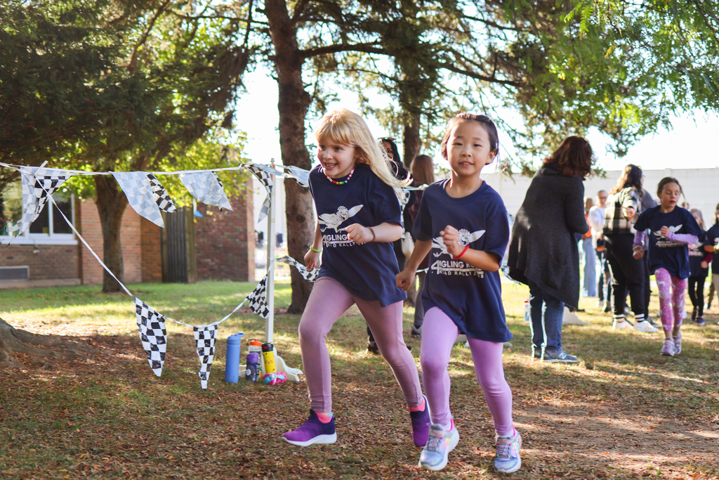 two girls running outside