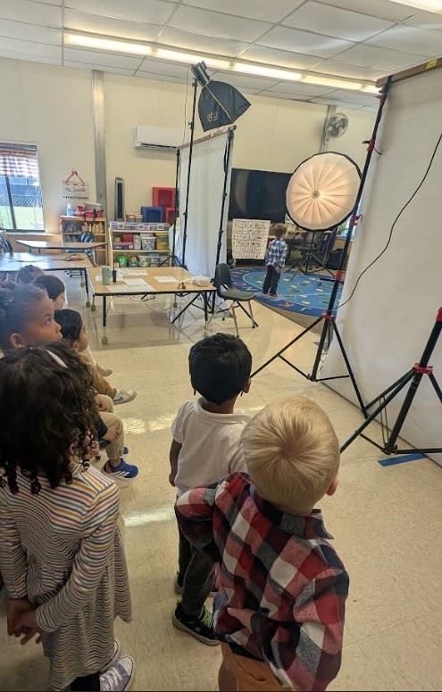 A group of 4 Year Olds waiting to get their picture taken.