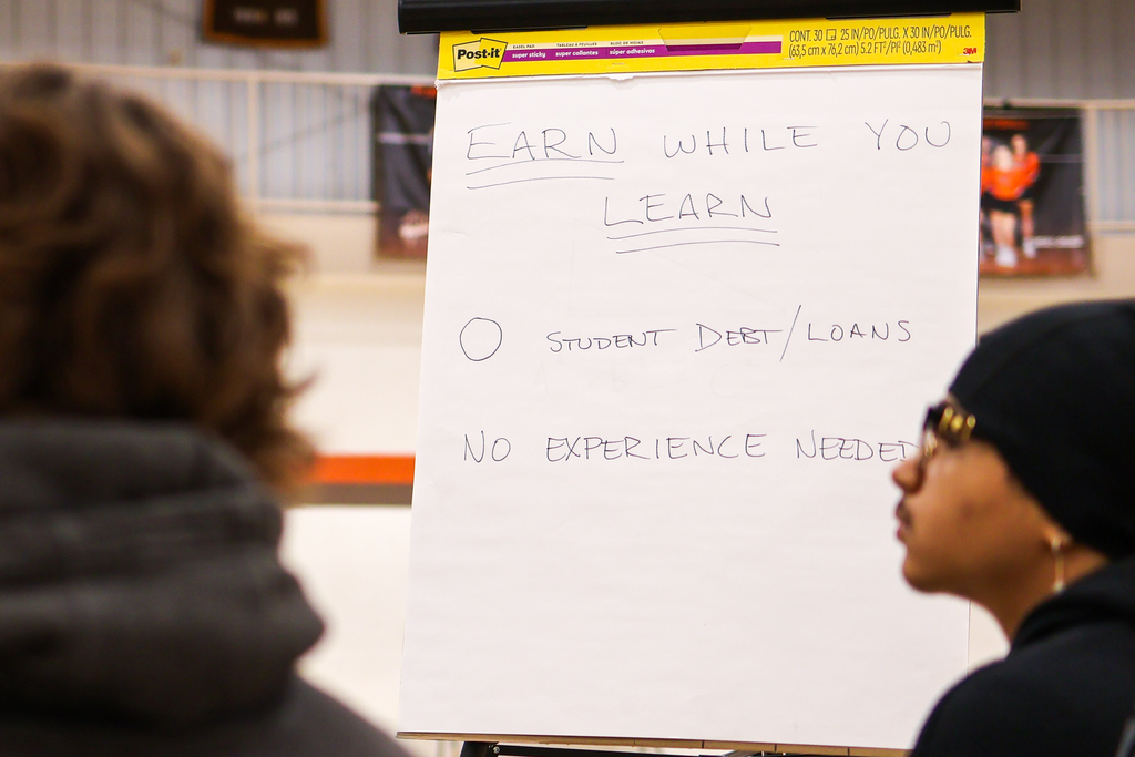 a board that says earn while you learn, 0 student debt/loans & no experience needed
