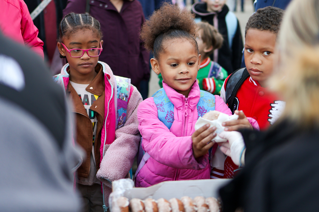 students getting donuts outside