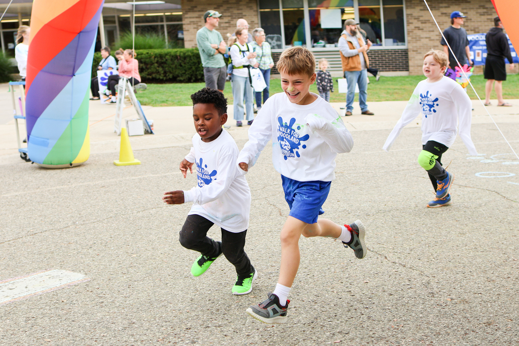 boys running outside an elementary school
