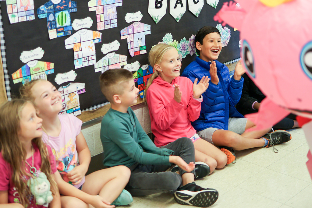 students cheering in a hallway