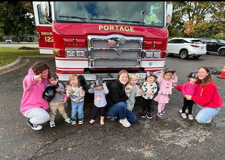 Mixed Age Class in front of a fire truck.