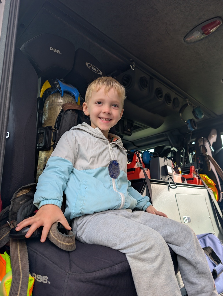 4 Year Old in a fire truck,