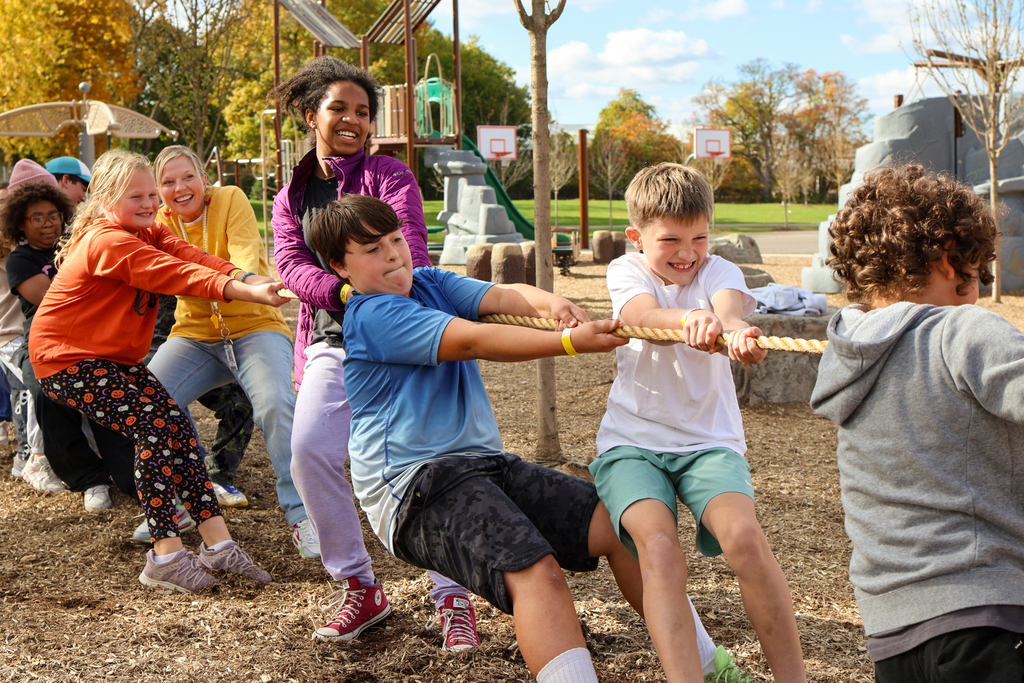 students pulling on a rope during tug-of-war