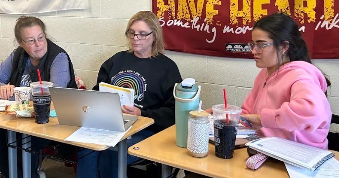 Three Teachers working together.