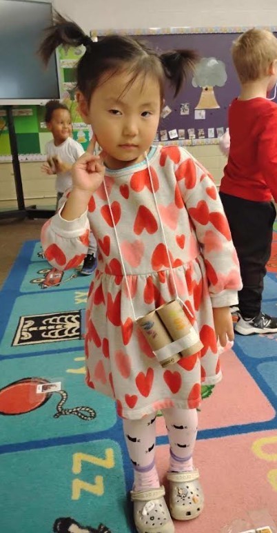 Student showing her project to the camera.