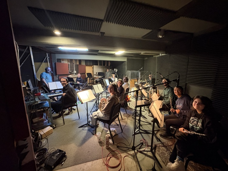 a pit under a stage with musicians