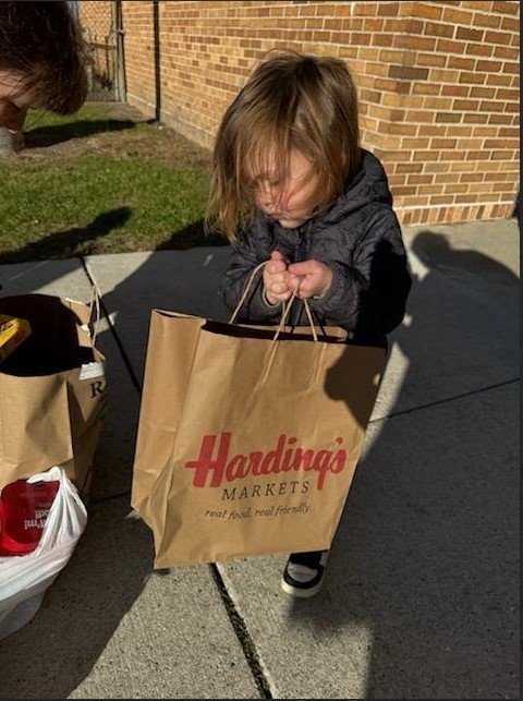 A boy carrying a bag.