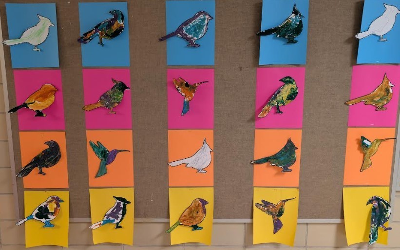 Artwork displayed in the halls with birds.