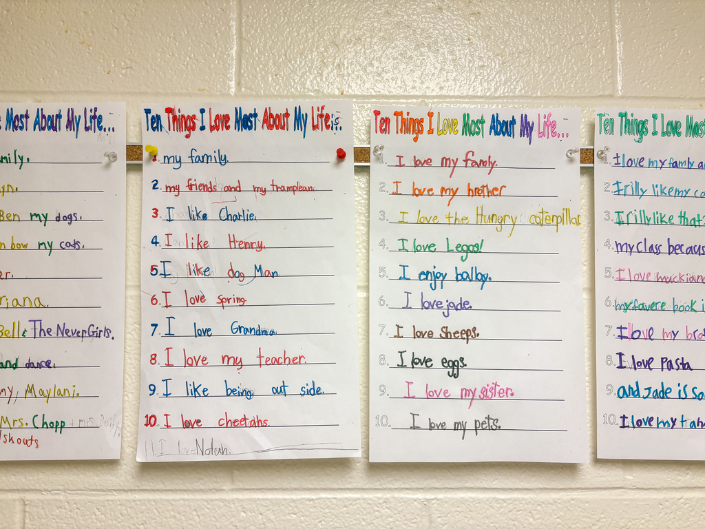 student artwork hung on a school hallway wall