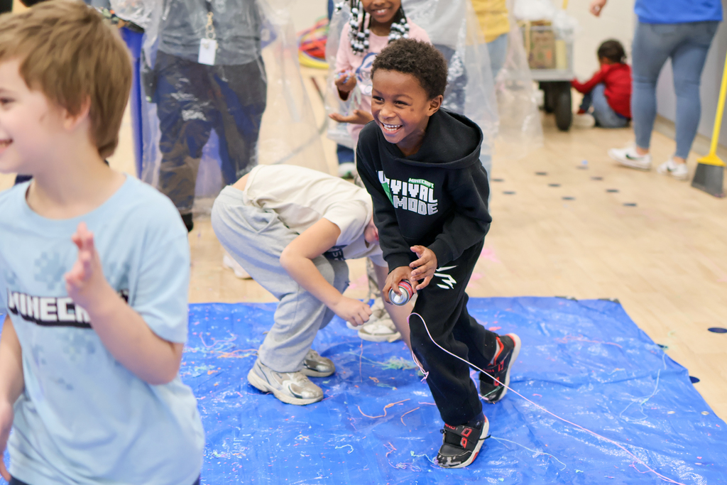 a boy running and smiling