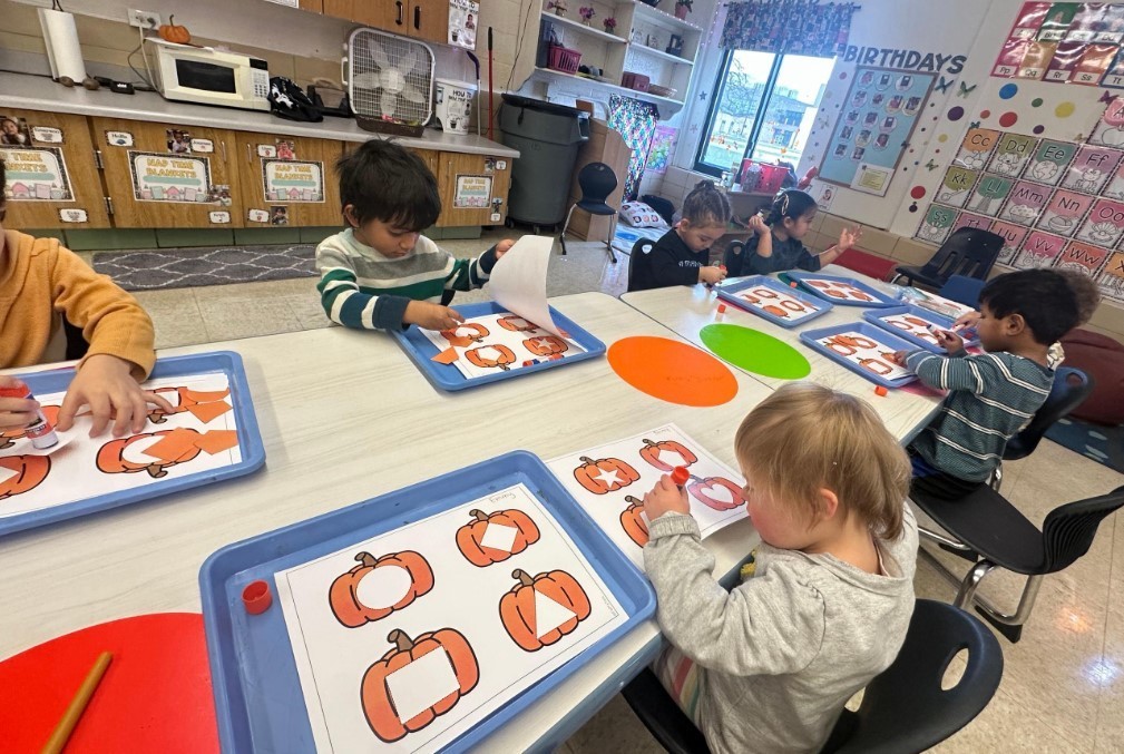 Students working on pumpkin art.