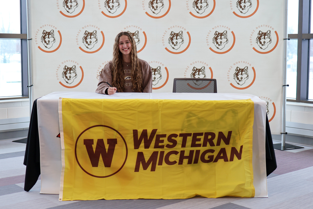 pn student signing commitment to play volleyball at wmu