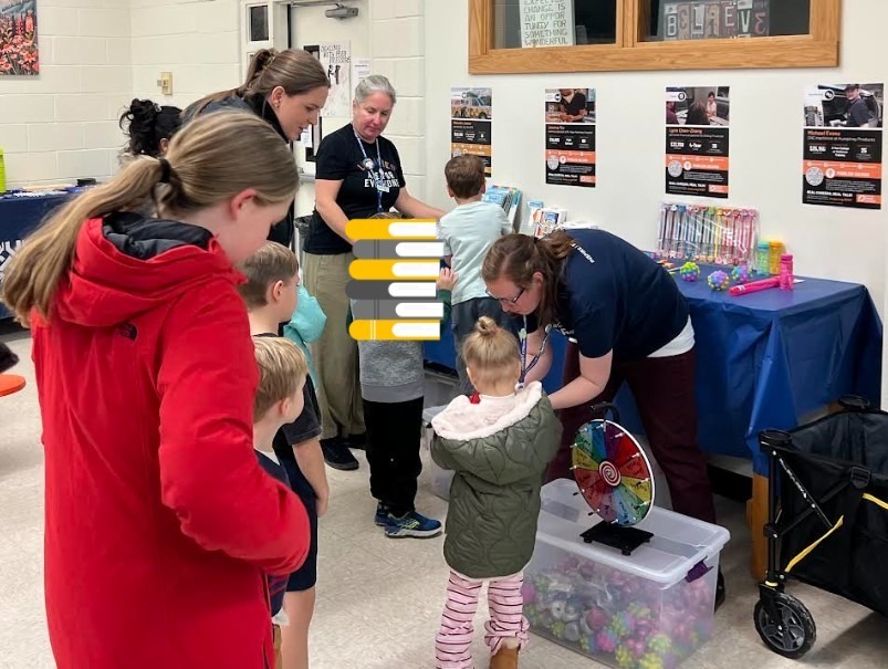Students talking with the Portage Public Library staff.