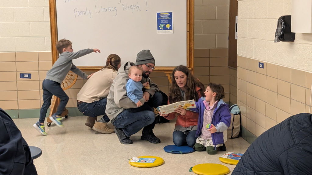 A family looking at books.