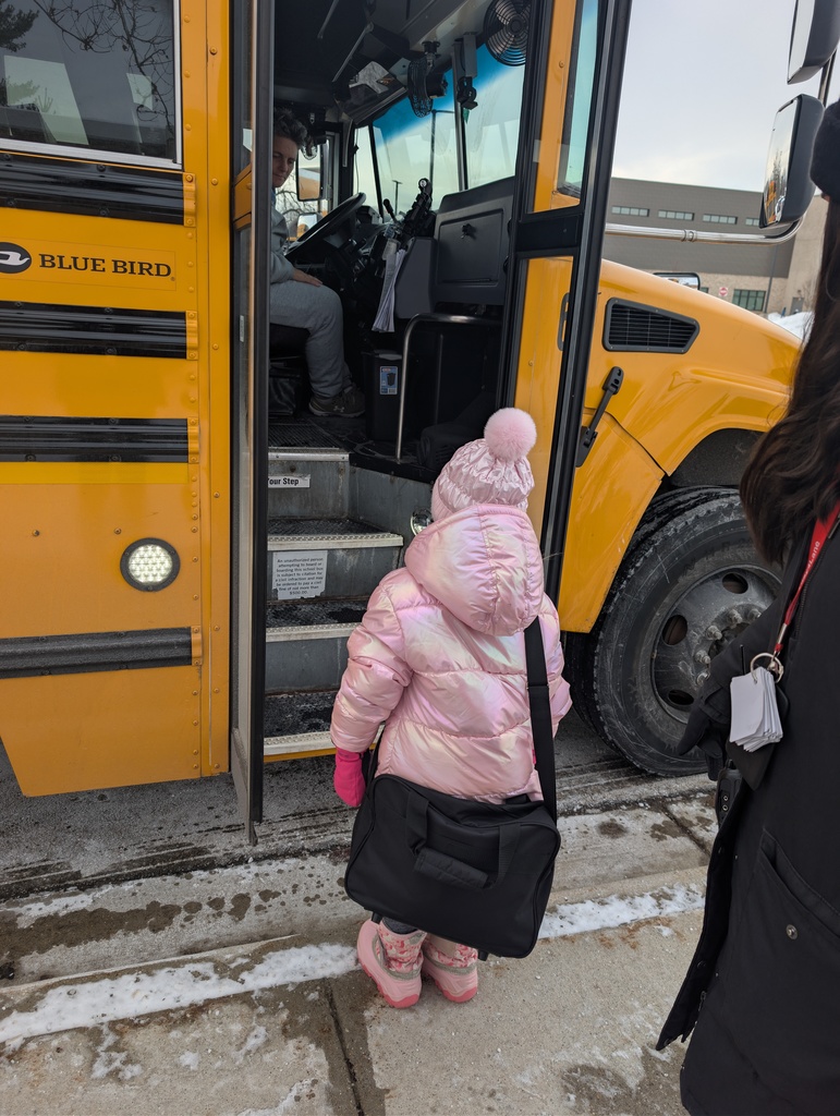 Student getting on the bus.