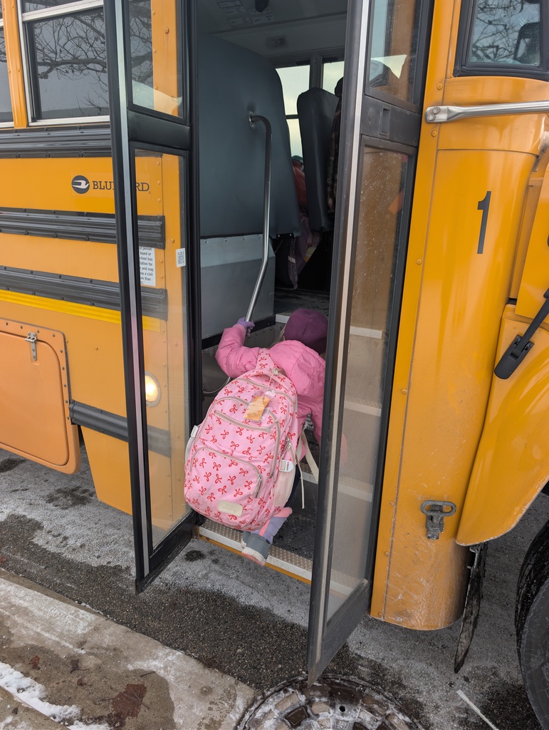Student getting on a bus alone.