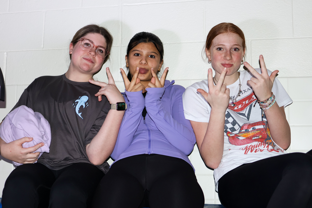 three girls posing for a photo