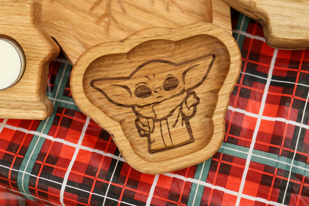 a baby Yoda burned into wood