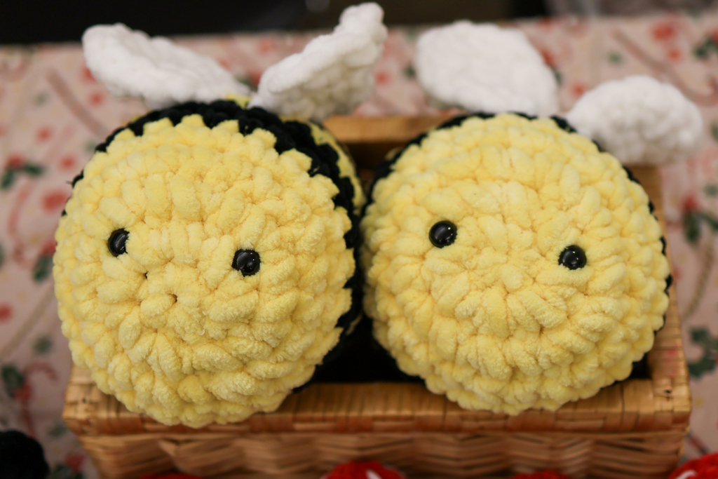 two crocheted bumble bees