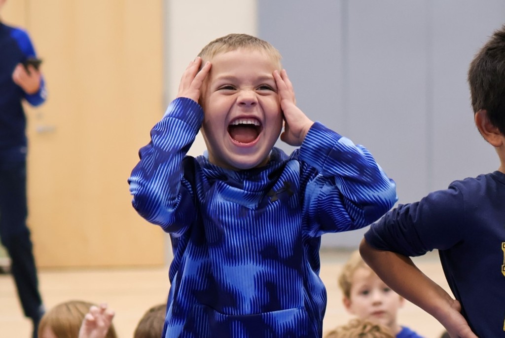 a boy with a big smile on his face