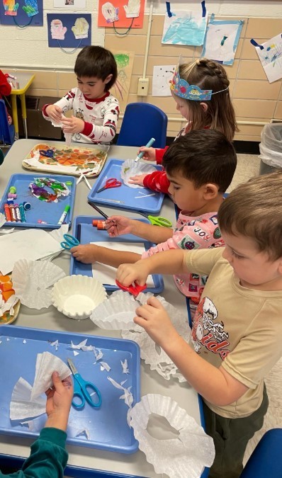 Kids making snowflakes.