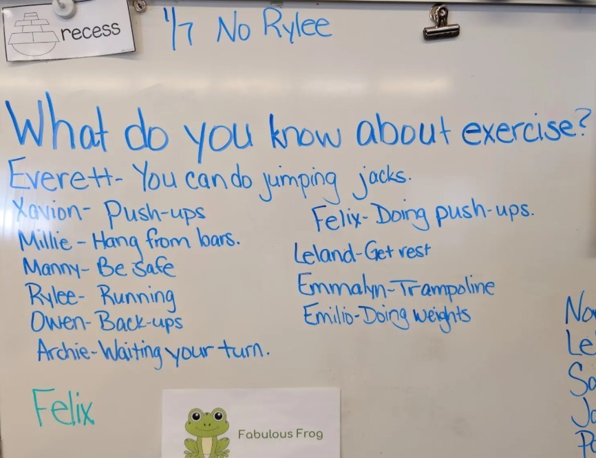 A whiteboard with writting about exercize activities.
