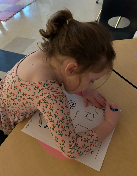 Female students working on her handwriting.