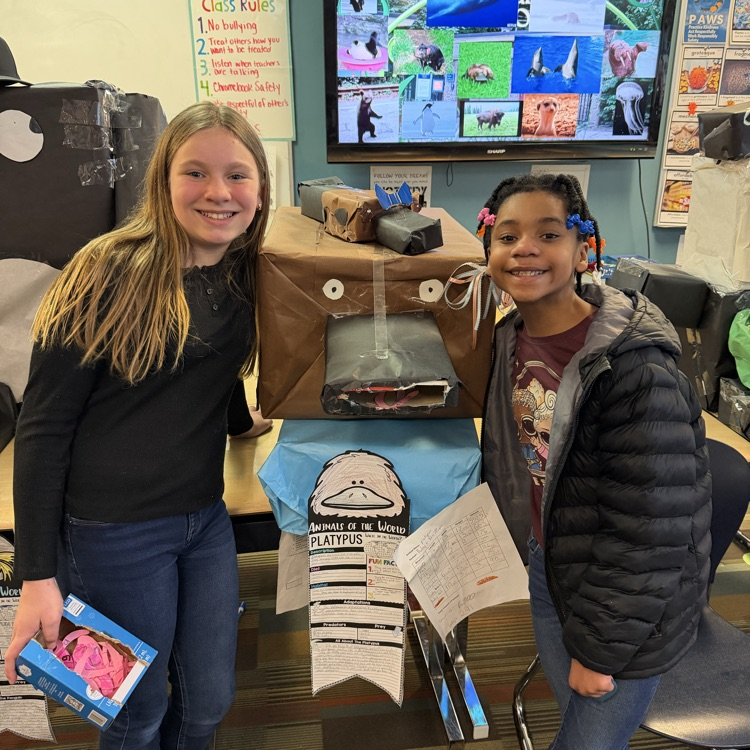 students with a cardboard platapus
