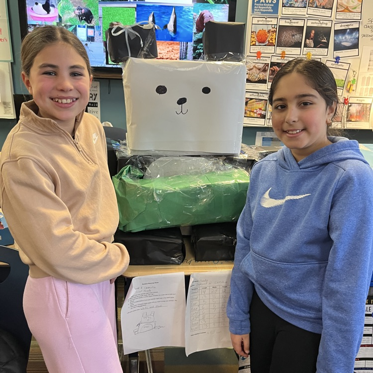 students with a cardboard animal