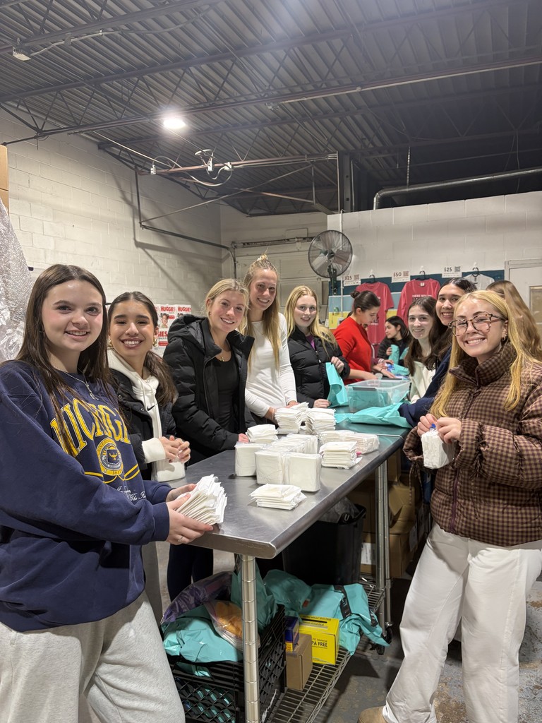 a group of girls working on packaging